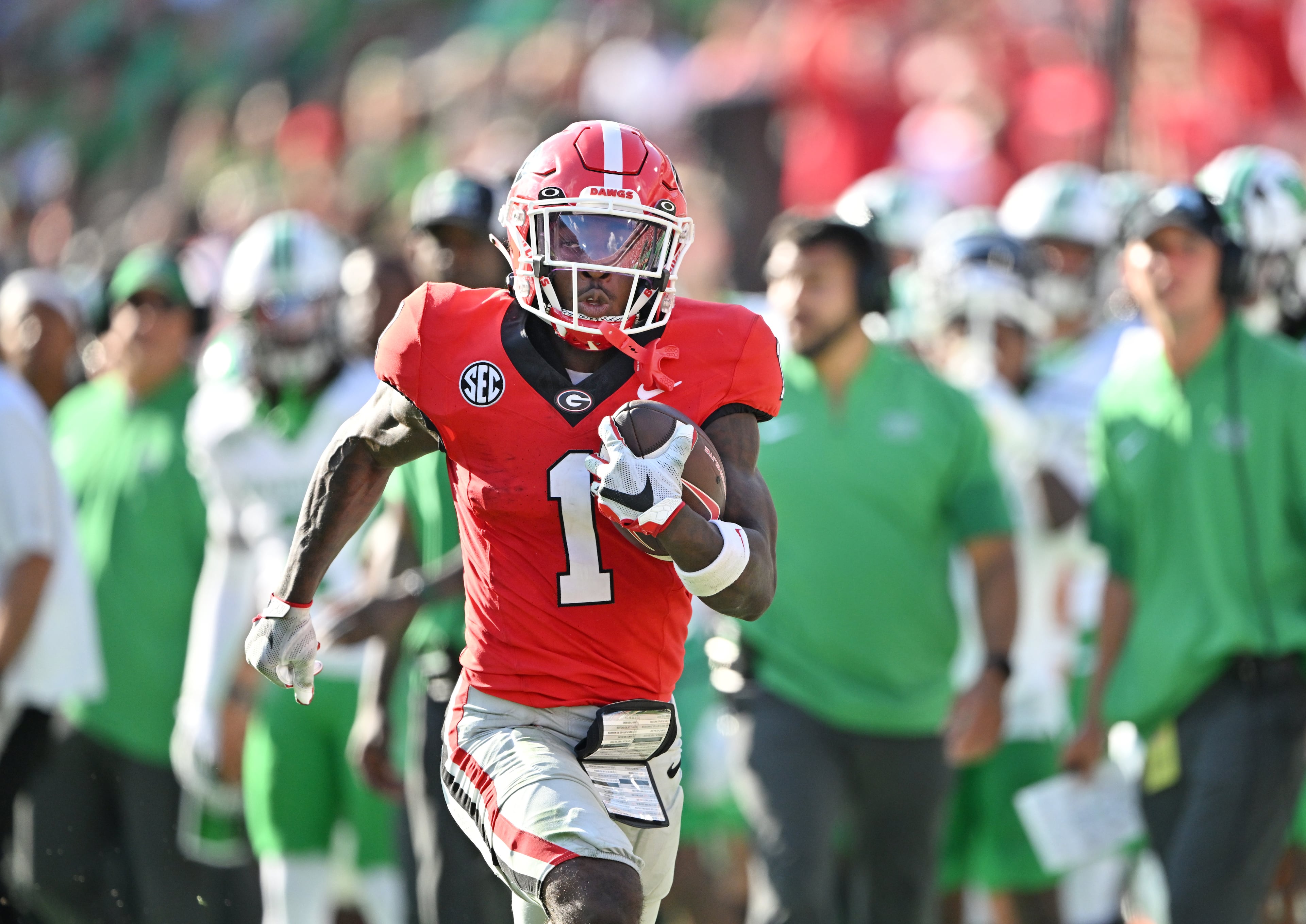 Georgia fans celebrate after wide receiver Zachariah Branch (1) runs for a touchdown during the second half in an NCAA football game at Sanford Stadium, Saturday, August 30, 2025, in Athens. Georgia won 45-7 over Marshall. (Hyosub Shin / AJC)