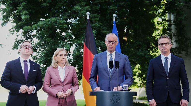 From left: Federal Chancellor Friedrich Merz arrives with Philipp Amthor, Nina Warken and Carsten Linnemann and for statement about planned personnel changes in his government at the chancellery in Berlin, Germany, Friday, July 24, 2026. (AP Photo/Markus Schreiber)