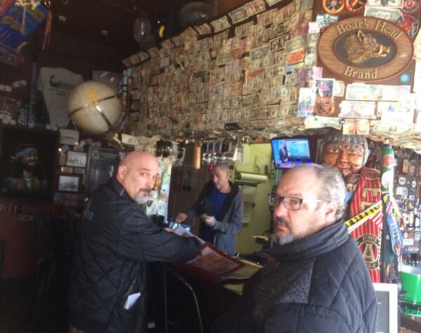 Mike Jakob, left, and his brother Pete, owners of the Elliot Street Deli and Pub, resurrected an old brick building 14 years ago and turned it into a local eatery. Photo by Bill Torpy
