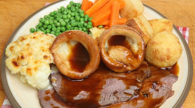 Roast beef with Yorkshire pudding, vegetables and gravy is a standard Sunday dinner in Britain. (GETTY IMAGES)
