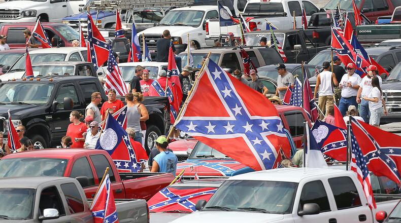 Hundreds of Confederate flag enthusiasts rallied at Stone Mountain Park Aug. 1, attracting a handful of counter protesters.