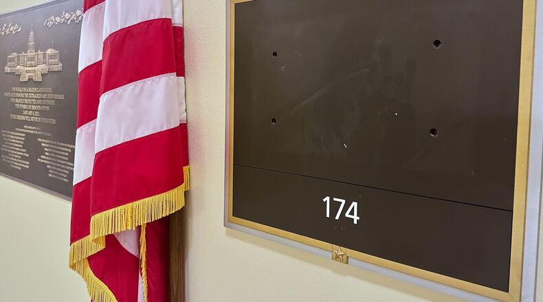 FILE - The name plate of Rep. Eric Swalwell, D-Calif., has been removed from his former office, April 15, 2026, on Capitol Hill in Washington. (AP Photo/Nathan Ellgren, File)