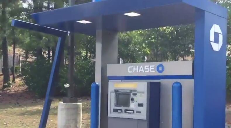 A woman was robbed at a Chase Bank ATM in Sandy Springs.