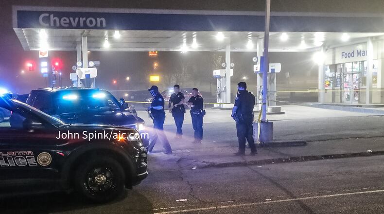 Atlanta police investigate a February double shooting outside a Chevron station on Martin Luther King Jr. Drive. The department has investigated 37 homicides so far this year.