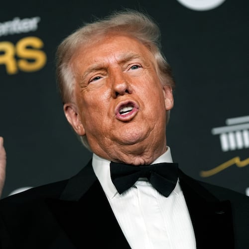 President Donald Trump talks to the media while walking the red carpet before the 48th Kennedy Center Honors, Sunday, Dec. 7, 2025, at the John F. Kennedy Center for the Performing Arts in Washington. (AP Photo/Julia Demaree Nikhinson)