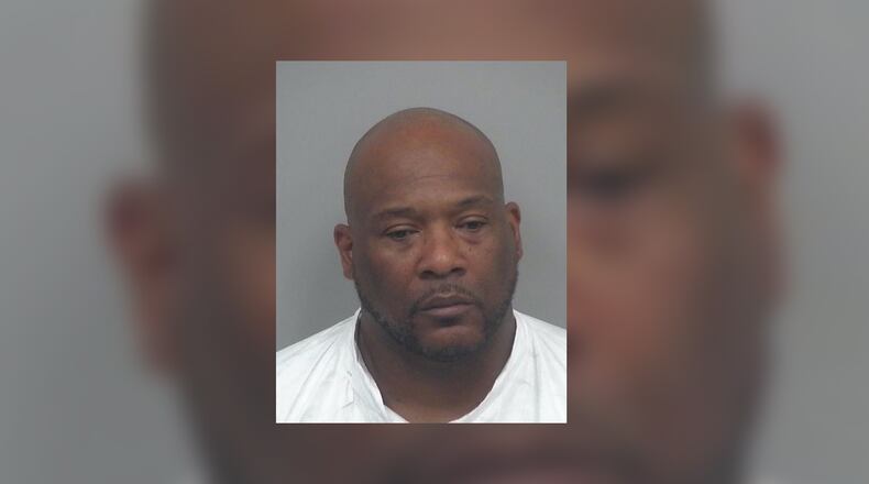 Andre King, 49, of Lilburn, was arrested on a murder charge after Gwinnett County police found a woman with a fatal gunshot wound near King's home, officials said. Her shooting death was one of two investigated by Gwinnett police over the weekend.