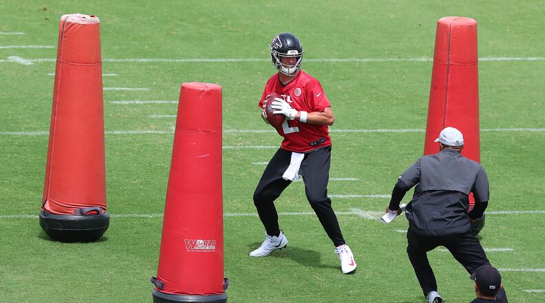 Falcons quarterback Matt Ryan works from inside the pocket during a team offensive drill at minicamp Wednesday, June 10, 2021, in Flowery Branch. (Curtis Compton / Curtis.Compton@ajc.com)