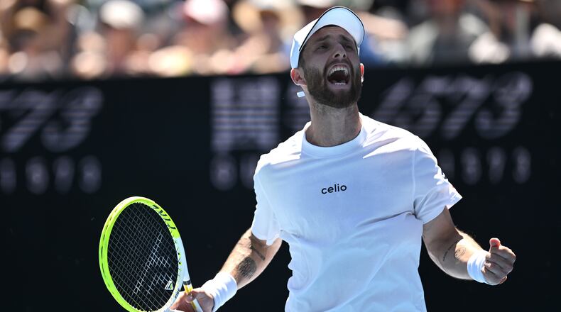 Corentin Moutet of France reacts during his first round match against Tristan Schoolkate of Australia at the Australian Open tennis championship in Melbourne, Australia, Sunday, Jan. 18, 2026. (Lukas Coch/AAP Image via AP)
