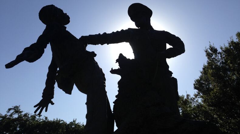 In this Oct. 15, 2015 file photo, a statue of police attacking civil rights protesters sits in Birmingham, Ala., where advocates say officials are doing a good job at preserving sites linked to civil rights. From a Civil War battlefield involving Hispanic Union soldiers to birthplaces of well-known civil rights leaders, some other sites linked to key moments of the nation’s civil rights are overlooked, neglected and at-risk of being forgotten. They are in danger of being lost to history even amid dramatic demographic shifts that could make the nation majority-minority by mid-century. (AP Photo/Russell Contreras, File)