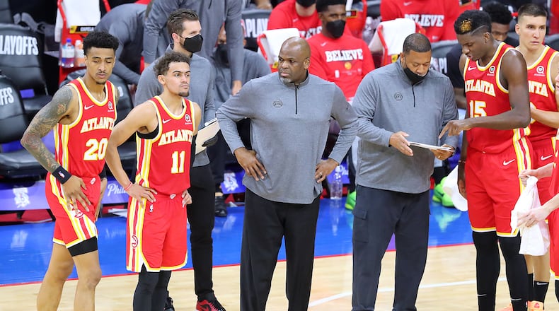 Hawks interim head coach Nate McMillan (center) calls a time out against the Philadelphia 76ers during the final minutes of Game 2 of the Eastern Conference semifinal Tuesday, June 8, 2021, in Philadelphia. (Curtis Compton / Curtis.Compton@ajc.com)