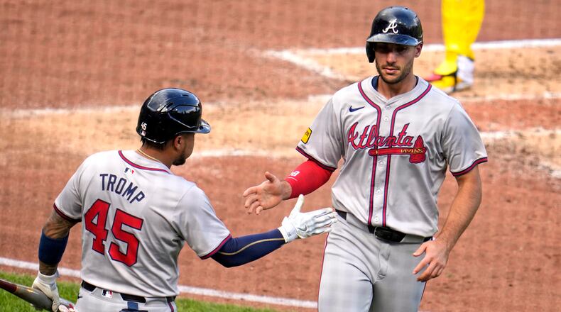 Atlanta Braves' Matt Olson, right, is greeted by Chadwick Tromp after scoring on a single by Jarred Kelenic off Pittsburgh Pirates starting pitcher Mitch Keller during the fourth inning of a baseball game in Pittsburgh, Saturday, May 25, 2024. (AP Photo/Gene J. Puskar)