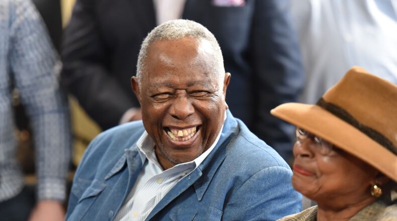 February 9, 2017 Atlanta - Hank Aaron, Braves Senior Vice President, shares a laugh with his Billye Aaron (right) during a press conference to make dedications at the new SunTrust Park to former vice president of player personnel Bill Lucas at SunTrust Park on Thursday, February 9, 2017. HYOSUB SHIN / HSHIN@AJC.COM