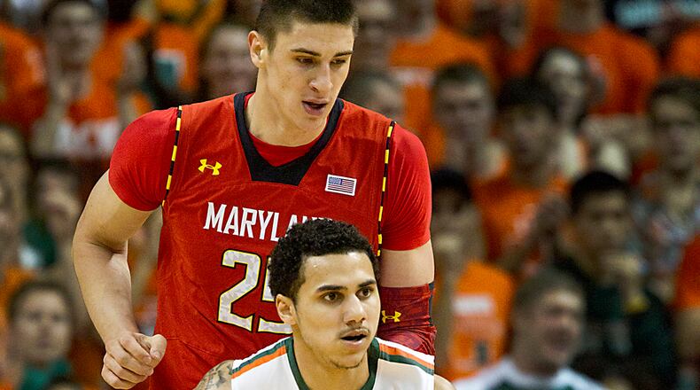 Shane Larkin of Miami leads the break with Alex Len of Maryland trailing in the first half of a men's college basketball game at the BankUnited Center on Sunday, January 13, 2013, in Coral Gables, Florida. (C.W. Griffin/Miami Herald/MCT)