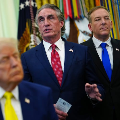 Interior Secretary Doug Burgum speaks as President Donald Trump, foreground, and from left, Energy Secretary Chris Wright and Environmental Protection Agency administrator Lee Zeldin, listen at an event about coal, Thursday, June 4, 2026, in the Oval Office of the White House in Washington. (AP Photo/Julia Demaree Nikhinson)