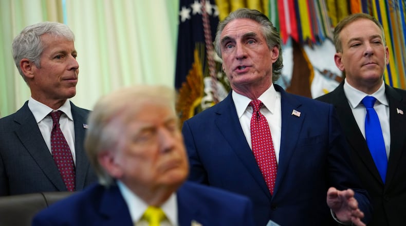 Interior Secretary Doug Burgum speaks as President Donald Trump, foreground, and from left, Energy Secretary Chris Wright and Environmental Protection Agency administrator Lee Zeldin, listen at an event about coal, Thursday, June 4, 2026, in the Oval Office of the White House in Washington. (AP Photo/Julia Demaree Nikhinson)