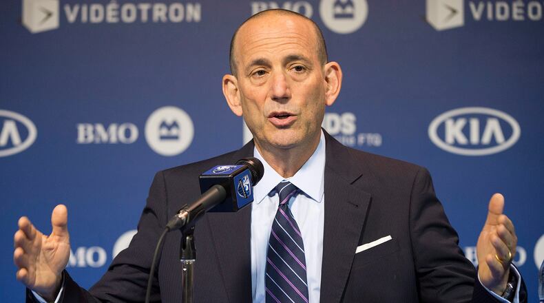 FILE - In this June 11, 2014, file photo, MLS Commissioner Don Garber speaks to reporters prior to an MLS soccer game between the Montreal Impact and DC United in Montreal. Garber says he doesn�t see the MLS Cup final between two small market teams _ Portland and Columbus _ as less-than ideal. (AP Photo/The Canadian Press, Graham Hughes)