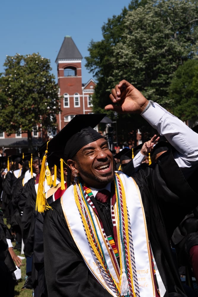 Co-salutatorian O’Rell Roberts cheers during the Morehouse College graduation Sunday, May 17, 2026. (Ben Gray for the AJC)