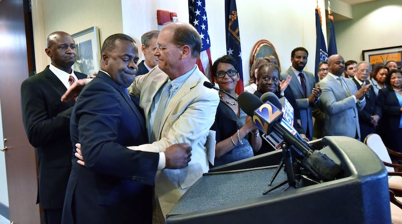 Atlanta Mayor Kasim Reed and Richard Anderson, CEO of Delta Air Lines, get emotional in April before they sign a new lease deal that will keep Delta’s headquarters at Atlanta’s airport for the next two decades. HYOSUB SHIN / HSHIN@AJC.COM