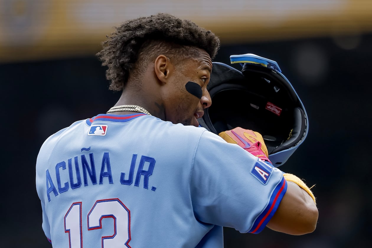 Atlanta Braves' Ronald Acuna Jr. adjusts his helmet while standing on third base against the Pittsburgh Pirates during the first inning of a baseball game, Saturday, June 6, 2026, in Atlanta. (Erik S. Lesser/AP)