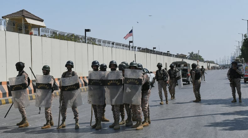 Paramilitary soldiers take positions at the U.S. Consulate after protesters stormed the building in Karachi, Pakistan, Sunday, March 1, 2026. (AP Photo/Ali Raza)