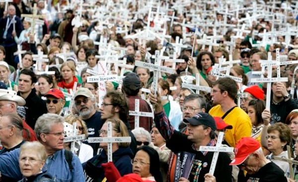 The Western Hemisphere Institute for Security Cooperation at Fort Benning has trained and educated more than 24,000 military, law enforcement and civilian students from 36 countries. This protest on Nov. 18, 2007, outside the installation was timed to commemorate six Jesuit priests who were killed along with their housekeeper and her daughter in El Salvador on Nov. 19, 1989. Some of the killers attended the School of the Americas, which operated at Fort Benning before Congress shut it down in 2000 and replaced it with the institute. (Rob Carr/AP)