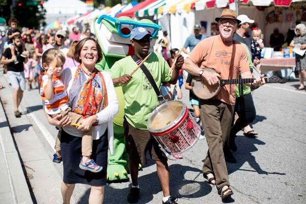 Among the activities each year at the AJC Decatur Book Festival is the parade, which has featured children’s author and Grand Marshal Carmen Agra Deedy, left. BRANDEN CAMP/SPECIAL