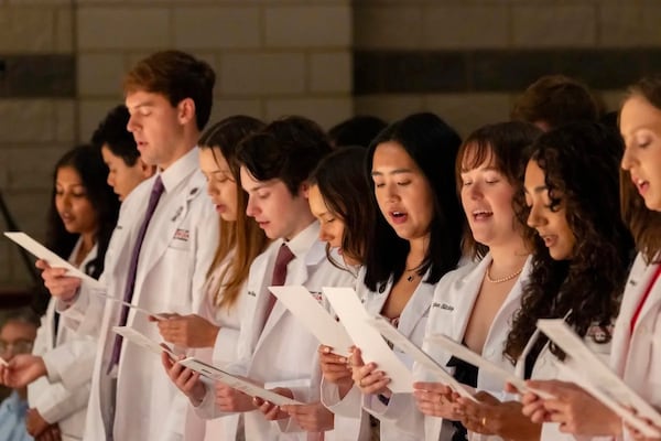 First year students at the UGA School of Medicine recite a medical oath after receiving their white coats during the White Coat Ceremony held at the Performing Arts Center. (Courtesy University of Georgia)