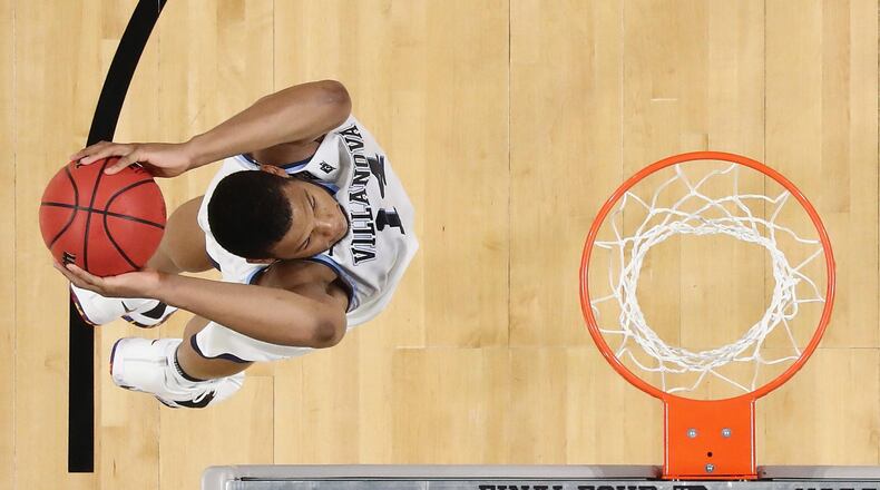 Omari Spellman #14 of the Villanova Wildcats goes up for a dunk in the second half against the Kansas Jayhawks during the 2018 NCAA Men's Final Four Semifinal at the Alamodome on March 31, 2018 in San Antonio, Texas. (Photo by Ronald Martinez/Getty Images)