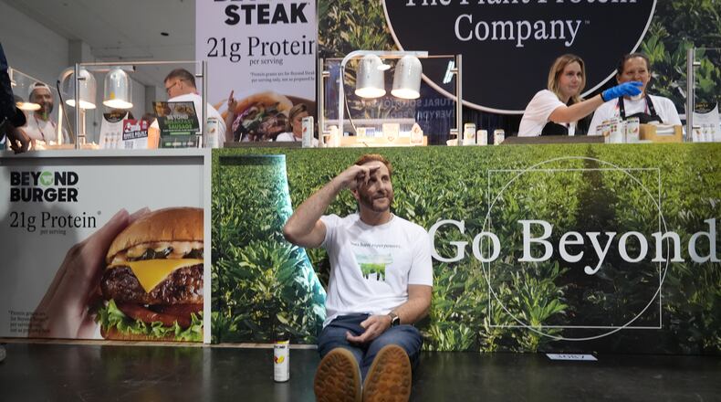 Beyond CEO Ethan Brown, the company's founder, poses for a photo at his Beyond booth as the company is transitioning from Beyond Meat to just Beyond, to introduce a new line of sparkling plant‑protein drinks at the Natural Products Expo West 2026 at the Anaheim Convention Center in Anaheim, Calif., on Thursday, March 5, 2026. (AP Photo/Damian Dovarganes)