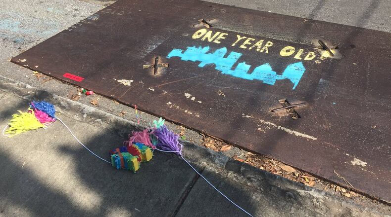 A big metal plate had been on McDonald Street for more than a year, so a couple decided to throw it a little party.