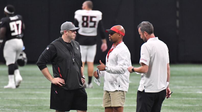 August 7, 2021 Atlanta - Atlanta Falcons head coach Arthur Smith talks with General Manager Terry Fontenot after the 2021 AT&T Atlanta Falcons Training Camp: Dirty Birds Open Practice at the Mercedes-Benz Stadium in Atlanta on Saturday, August 7, 2021. (Hyosub Shin / Hyosub.Shin@ajc.com)