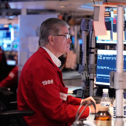 Daniel Kryger works on the floor at the New York Stock Exchange in New York, Thursday, Nov. 13, 2025. (AP Photo/Seth Wenig)