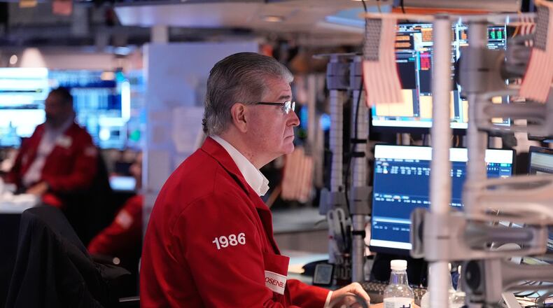 Daniel Kryger works on the floor at the New York Stock Exchange in New York, Thursday, Nov. 13, 2025. (AP Photo/Seth Wenig)