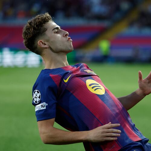 Barcelona's Fermin Lopez celebrates after scoring the opening goal of his team during the Champions League opening phase soccer match between Barcelona and Olympiacos in Barcelona, Spain, Tuesday, Oct. 21, 2025. (AP Photo/Joan Monfort)