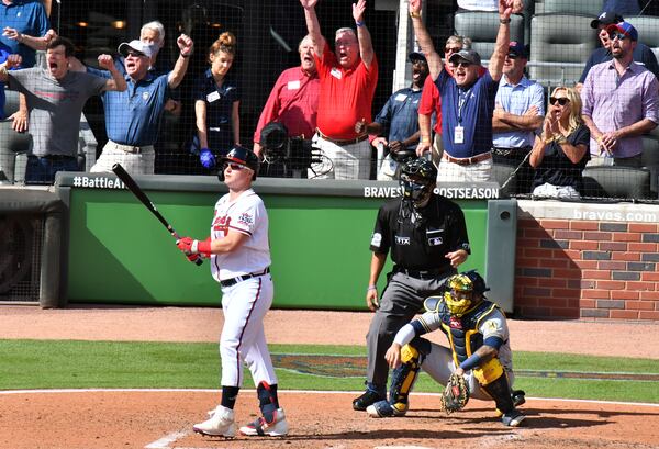 Braves left fielder Joc Pederson (22) follows through on a three-run home run during the 5th inning in Game 3 of National League Divisional Series at Truist Park on Monday, October 11. Atlanta Braves won 3-0 over Milwaukee Brewers. (Hyosub Shin / Hyosub.Shin@ajc.com)