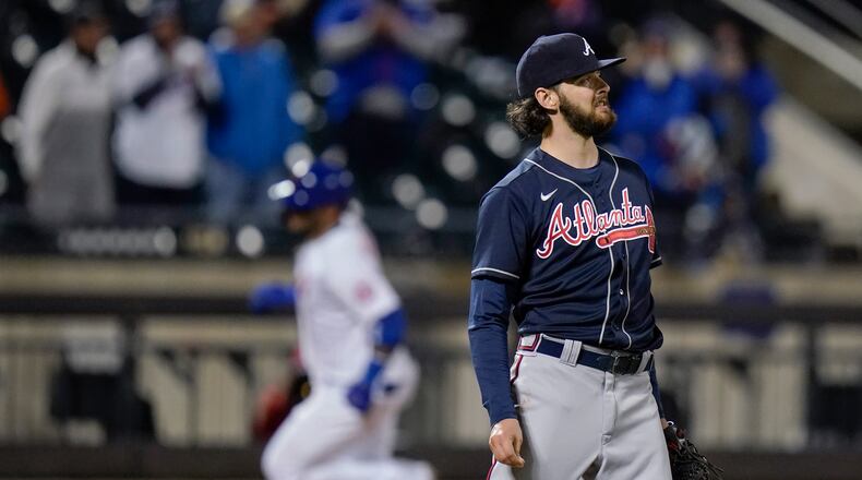 Atlanta Braves' Ian Anderson reacts as New York Mets' Jonathan Villar runs the bases on a home run during the fifth inning of a baseball game Saturday, May 29, 2021, in New York. (AP Photo/Frank Franklin II)