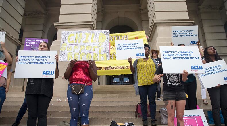 Abortion rights activists rally outside of the Georgia State Capitol building following the signing of HB 481 in Atlanta, Tuesday, May 7, 2019.  Georgia Governor Brian Kemp signed the bill, surrounded by supporters and Georgia lawmakers, in his office Tuesday morning.  (ALYSSA POINTER/ALYSSA.POINTER@AJC.COM)