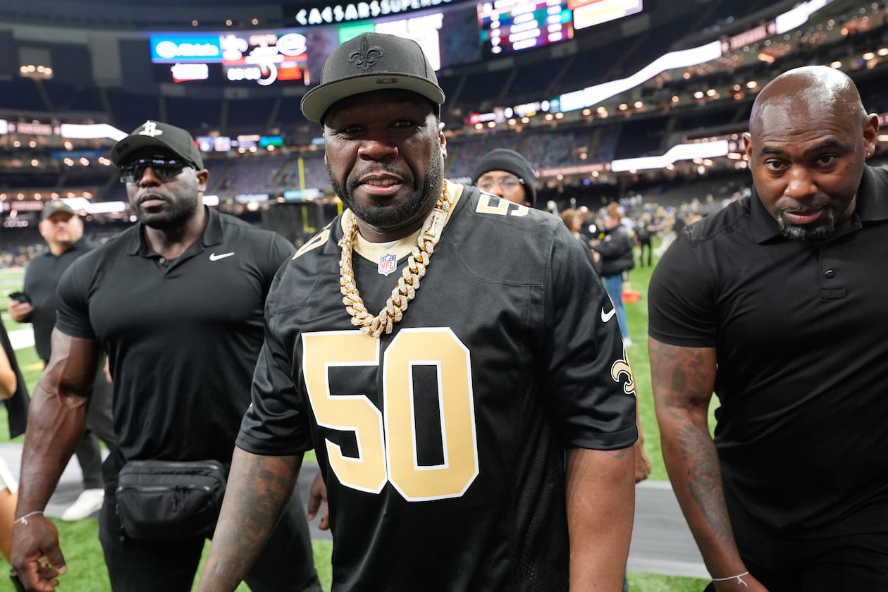 Rapper and actor 50 Cent walks on the sideline before an NFL football game between the New Orleans Saints and the New York Jets on Dec. 21, 2025, in New Orleans. (Gerald Herbert/AP)