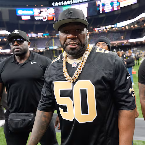 Rapper and actor 50 Cent walks on the sideline before an NFL football game between the New Orleans Saints and the New York Jets on Dec. 21, 2025, in New Orleans. (Gerald Herbert/AP)