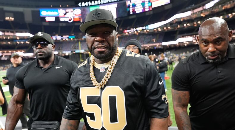 Rapper and actor 50 Cent walks on the sideline before an NFL football game between the New Orleans Saints and the New York Jets on Dec. 21, 2025, in New Orleans. (Gerald Herbert/AP)