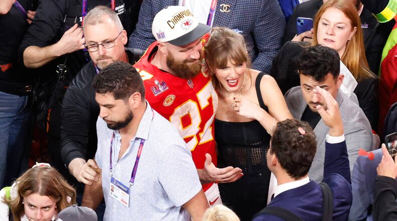 Kansas City Chiefs tight end Travis Kelce (87) and Taylor Swift celebrate the Chiefs' victory over the San Francisco 49ers in Super Bowl LVIII on Sunday, Feb. 11, 2024, at Allegiant Stadium in Las Vegas. (Bizuayehu Tesfaye/Las Vegas Review-Journal/TNS)