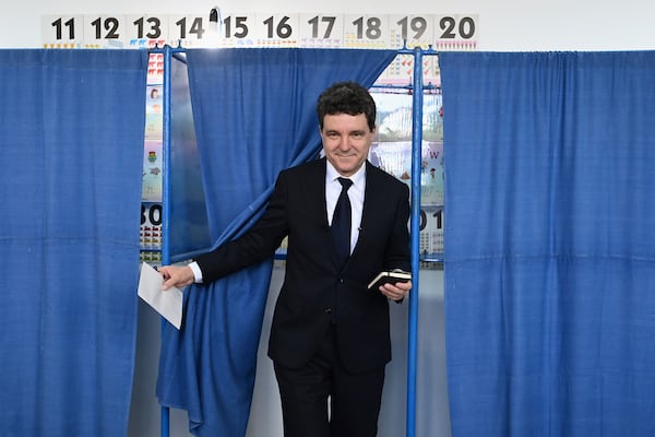 Presidential candidate Nicusor Dan exits a voting cabin before casting his vote in the second round of the country's presidential election redo in Fagaras, Romania, Sunday, May 18, 2025. (AP Photo/Eduard Vinatoru)