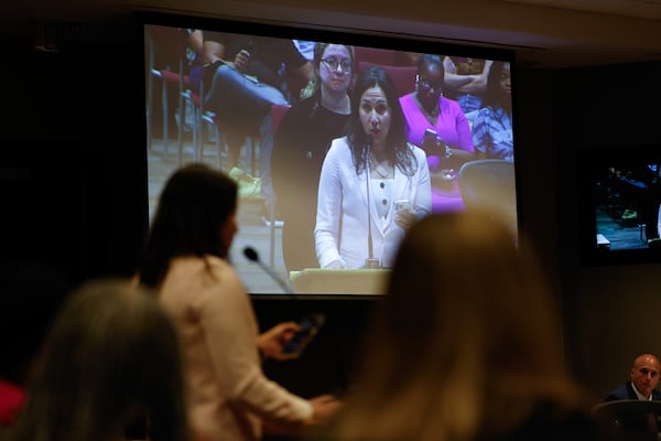 Parent Jessica Stern, a member of the Safe Space to Learn Coalition, speaks at an Atlanta Public Schools board meeting in Atlanta on Aug. 10, 2026. The coalition is advocating to pass a policy preventing ICE agent entry in schools. (Arvin Temkar/AJC)