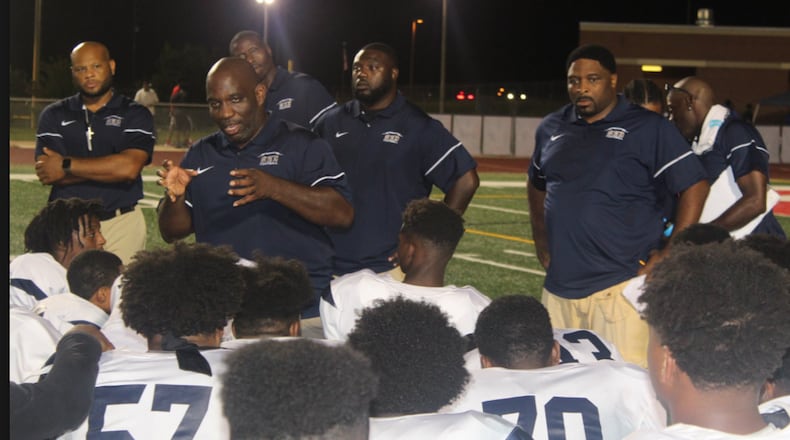 SW DeKalb coach Damien Wimes talks to team after Woodland win.