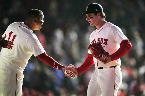 Boston Red Sox outfielder Roman Anthony, right, celebrates with designated hitter Rafael Devers (11) after defeating the Tampa Bay Rays in a baseball game at Fenway Park, Tuesday, June 10, 2025, in Boston. (AP Photo/Charles Krupa)