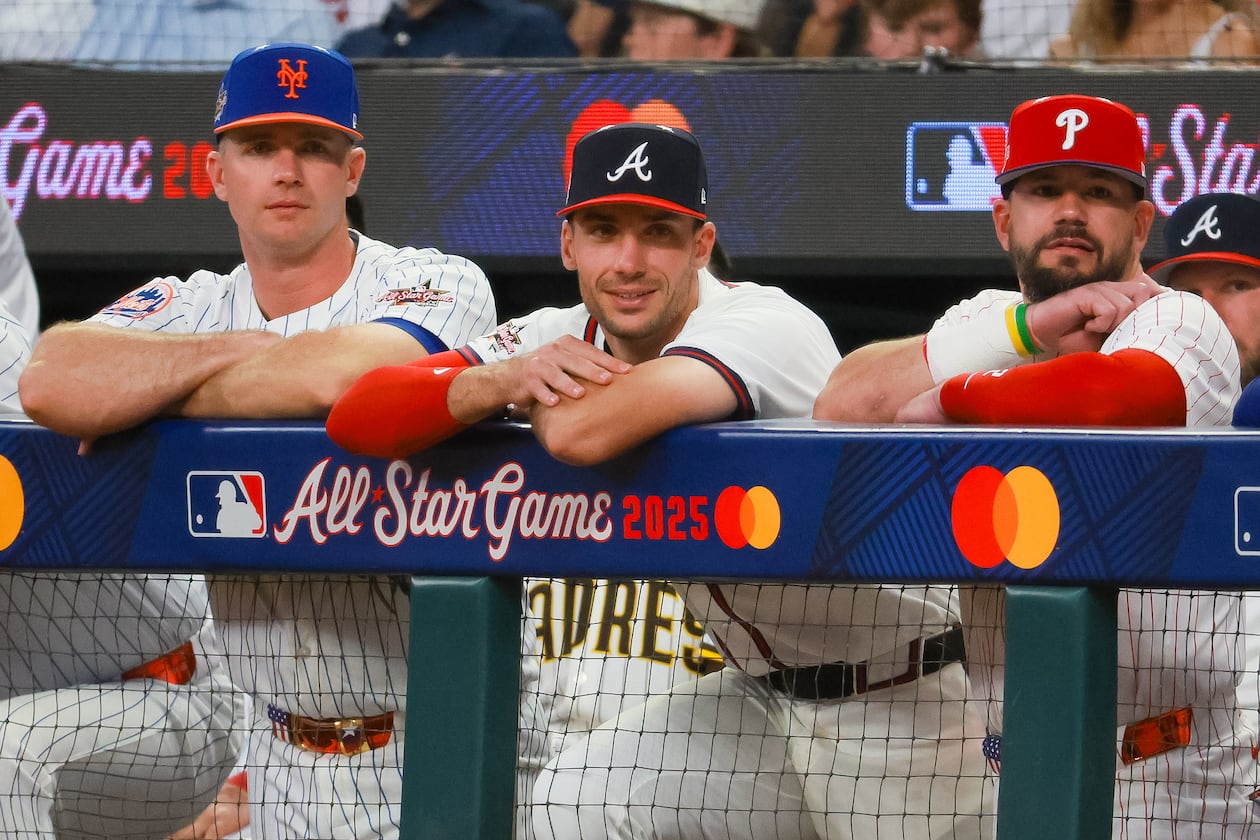 The National League's Matt Olson of the Atlanta Braves (center) stands between Pete Alonso of the New York Mets (left) and Kyle Schwarber of the Philadelphia Phillies (right) during the second inning of the MLB All-Star Game at Truist Park in Atlanta. (Jason Getz/AJC 2025)