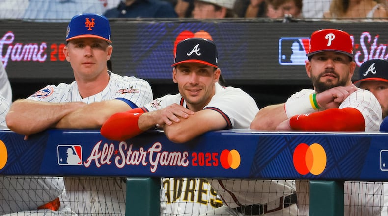 The National League's Matt Olson of the Atlanta Braves (center) stands between Pete Alonso of the New York Mets (left) and Kyle Schwarber of the Philadelphia Phillies (right) during the second inning of the MLB All-Star Game at Truist Park in Atlanta. (Jason Getz/AJC 2025)