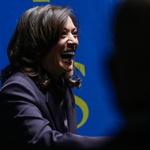 Former Vice President Kamala Harris greets people before she speaks, Friday, Oct. 17, 2025, in Birmingham, Ala. (AP Photo/Mike Stewart)