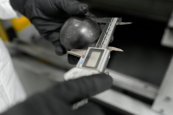 A TRISO fuel cell is measured Friday, June 27, 2025, in Oak Ridge, Tenn. (AP Photo/George Walker IV)