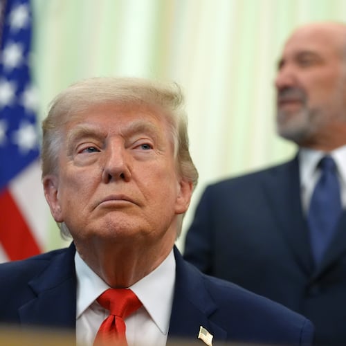 Commerce Secretary Howard Lutnick speaks before President Donald Trump, in foreground, signs a proclamation about the fishing industry, in the Oval Office of the White House, Thursday, June 11, 2026, in Washington. (AP Photo/Jacquelyn Martin)
